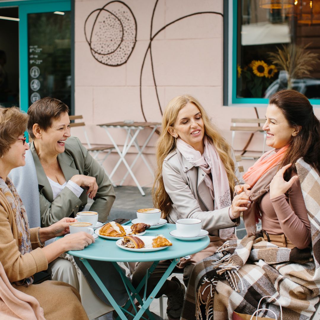 company-of-senior-woman-having-breakfast-on-a-terr-2025-02-22-17-50-01-utc